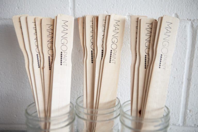 Mango Paint branded paint paddles so customers can stir their paint.
